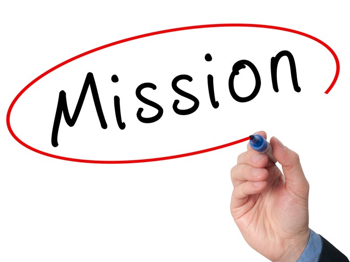 Hand writing Mission with marker on virtual screen